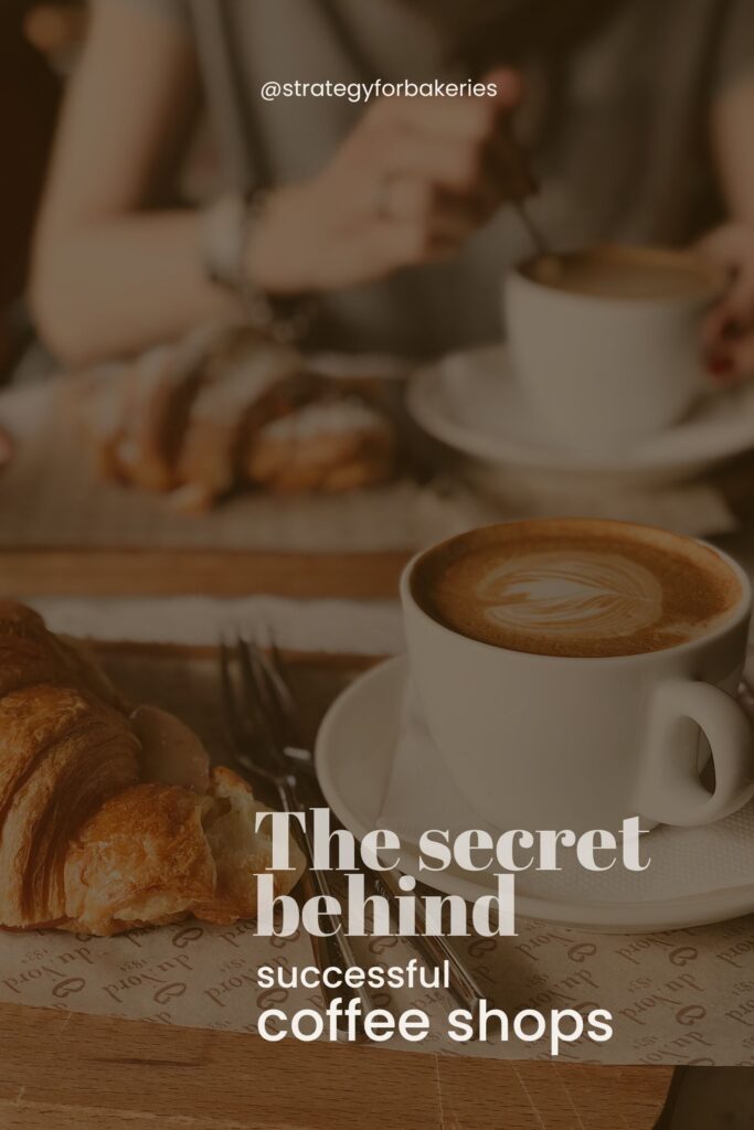 A cozy coffee shop scene with a close-up of a cappuccino in a white cup, placed on a tray alongside a buttery croissant. In the background, a person stirs their coffee, and another croissant is slightly out of focus. Overlaid text reads: 'The secret behind successful coffee shops' with the handle @strategyforbakeries at the top.